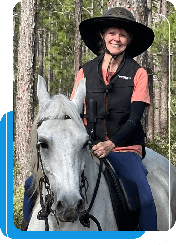 Shannon Morgan Riding on her beautiful white-gray horse